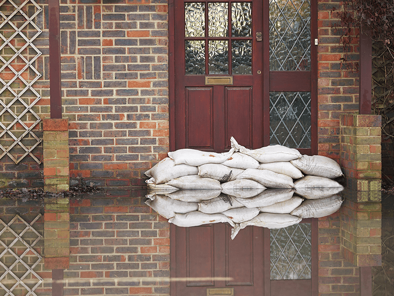sandbags covering front door during flood