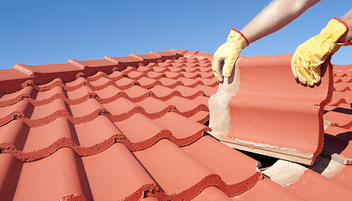 gentleman changing the roof on a residential home
